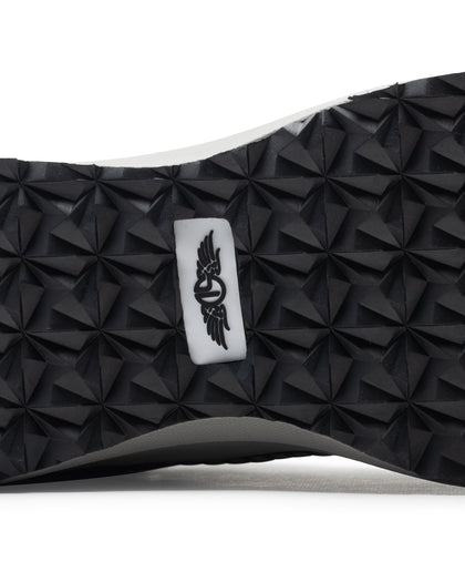 Men's Moonlight V2 Shoe in Black, close-up bottom view featuring a black geometric pyramid-textured rubber outsole with a centered white and black Straight Down logo badge and white midsole edge