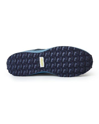 Men's Moonlight V2 Shoe in Deep Sea, bottom view featuring a navy geometric pyramid-textured rubber outsole with a white and gold Straight Down logo badge at the center