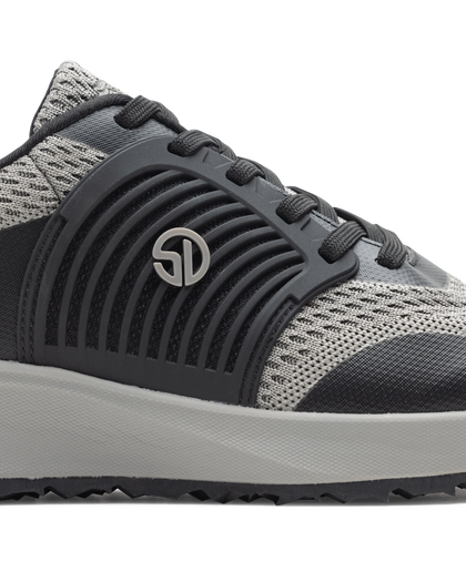 Men's Moonlight V2 Shoe in Black, close-up side view featuring charcoal ribbed rubber overlay with silver Straight Down logo medallion, light grey knit panels, and a white midsole