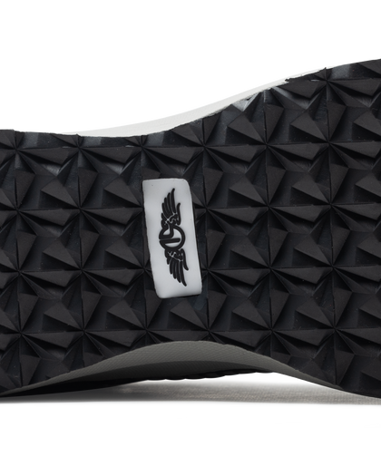 Men's Moonlight V2 Shoe in Black, close-up bottom view featuring a black geometric pyramid-textured rubber outsole with a centered white and black Straight Down logo badge and white midsole edge