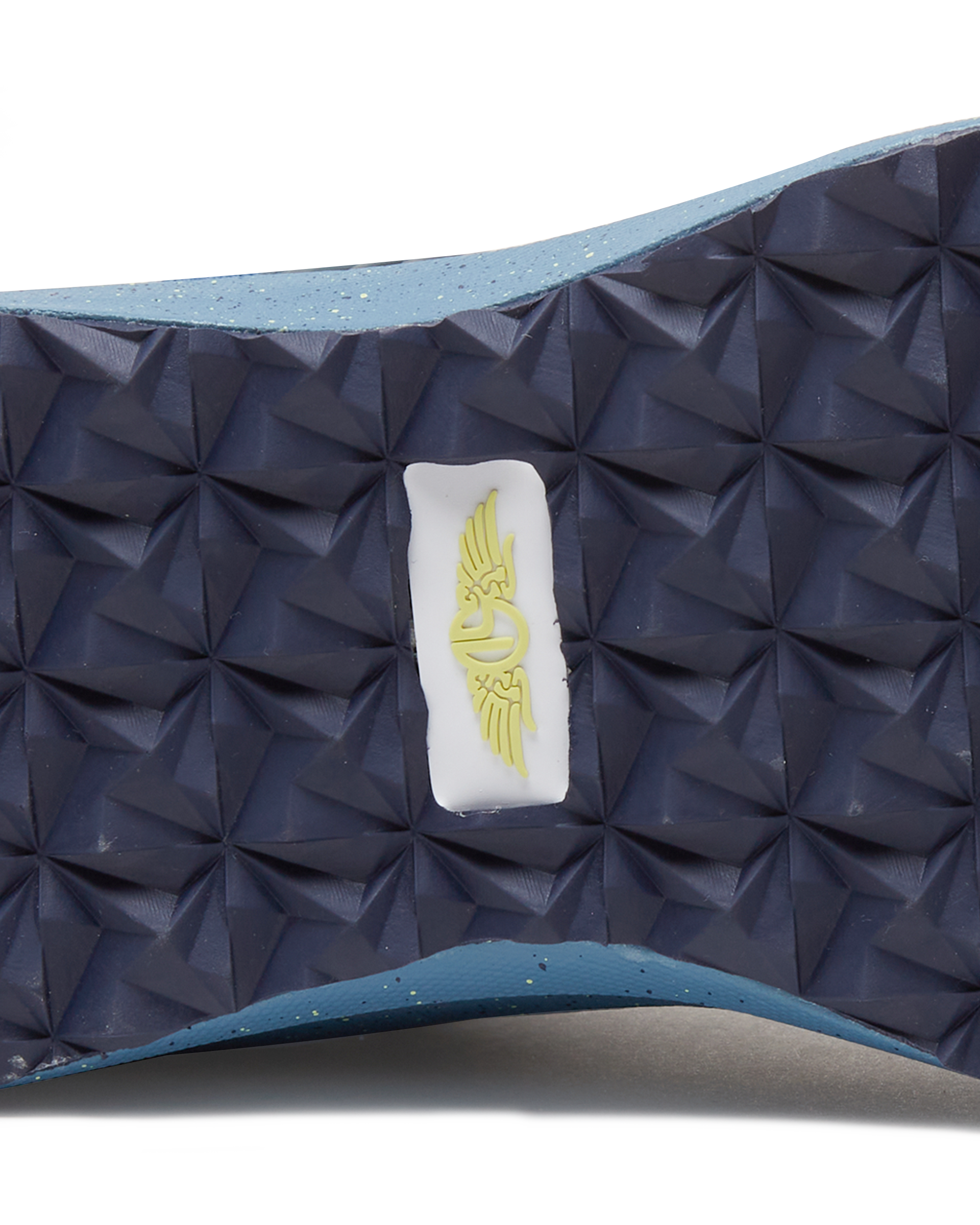 Men's Moonlight V2 Shoe in Deep Sea, close-up bottom view featuring a navy geometric pyramid-textured rubber outsole with a centered white and gold Straight Down logo badge and speckled light blue midsole edge