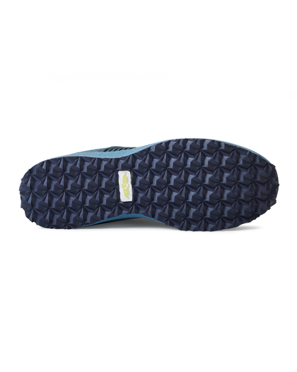 Men's Moonlight V2 Shoe in Deep Sea, bottom view featuring a navy geometric pyramid-textured rubber outsole with a white and gold Straight Down logo badge at the center