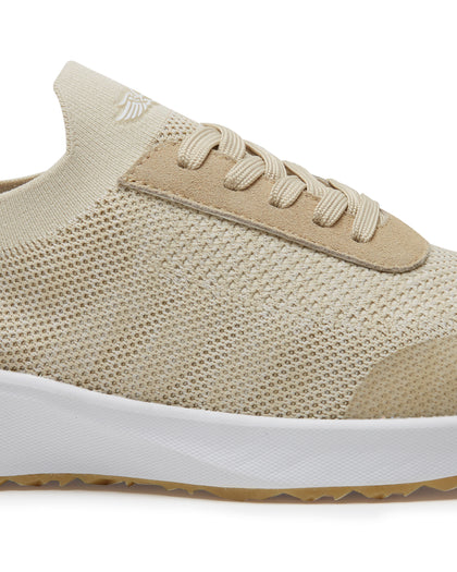 Straight Down Weekender Golf Shoe in Cashew, close-up lateral side detail view featuring cream knit upper, tan suede lace overlay, tan laces, Straight Down wing logo on knit tongue, and white midsole