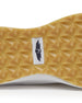 Straight Down Weekender Golf Shoe in Cashew, close-up outsole detail view featuring gum geometric pyramid traction outsole with Straight Down wing logo badge at arch