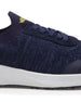 Straight Down Weekender Golf Shoe in New Indigo, close-up lateral side detail view featuring navy knit upper, yellow Straight Down wing logo on tongue, navy laces, and white midsole