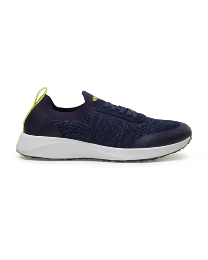 Straight Down Weekender Golf Shoe in New Indigo, lateral side profile view featuring navy knit upper, yellow Straight Down wing logo on tongue, yellow heel pull tab, navy laces, white midsole, and marbled traction outsole
