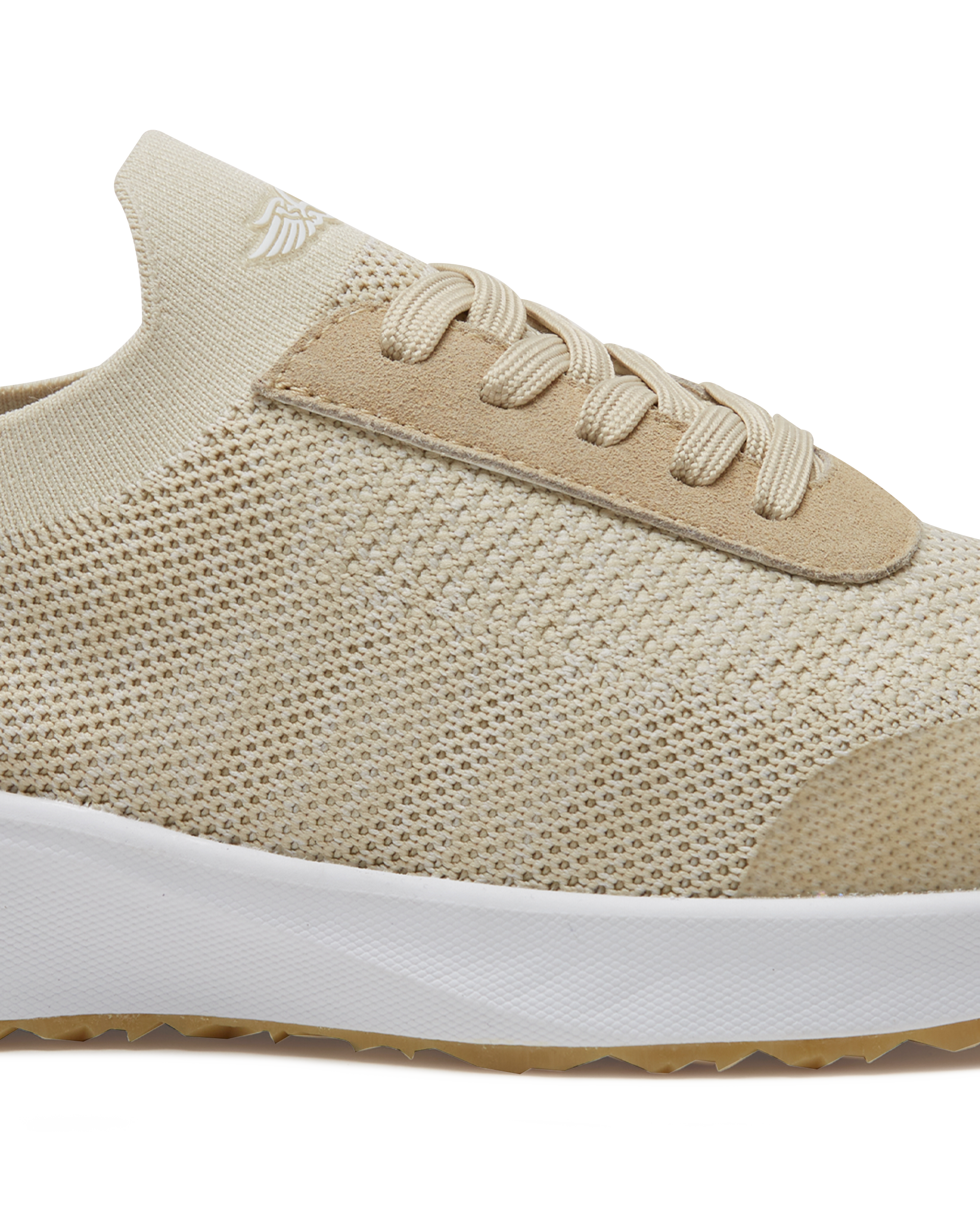 Straight Down Weekender Golf Shoe in Cashew, close-up lateral side detail view featuring cream knit upper, tan suede lace overlay, tan laces, Straight Down wing logo on knit tongue, and white midsole
