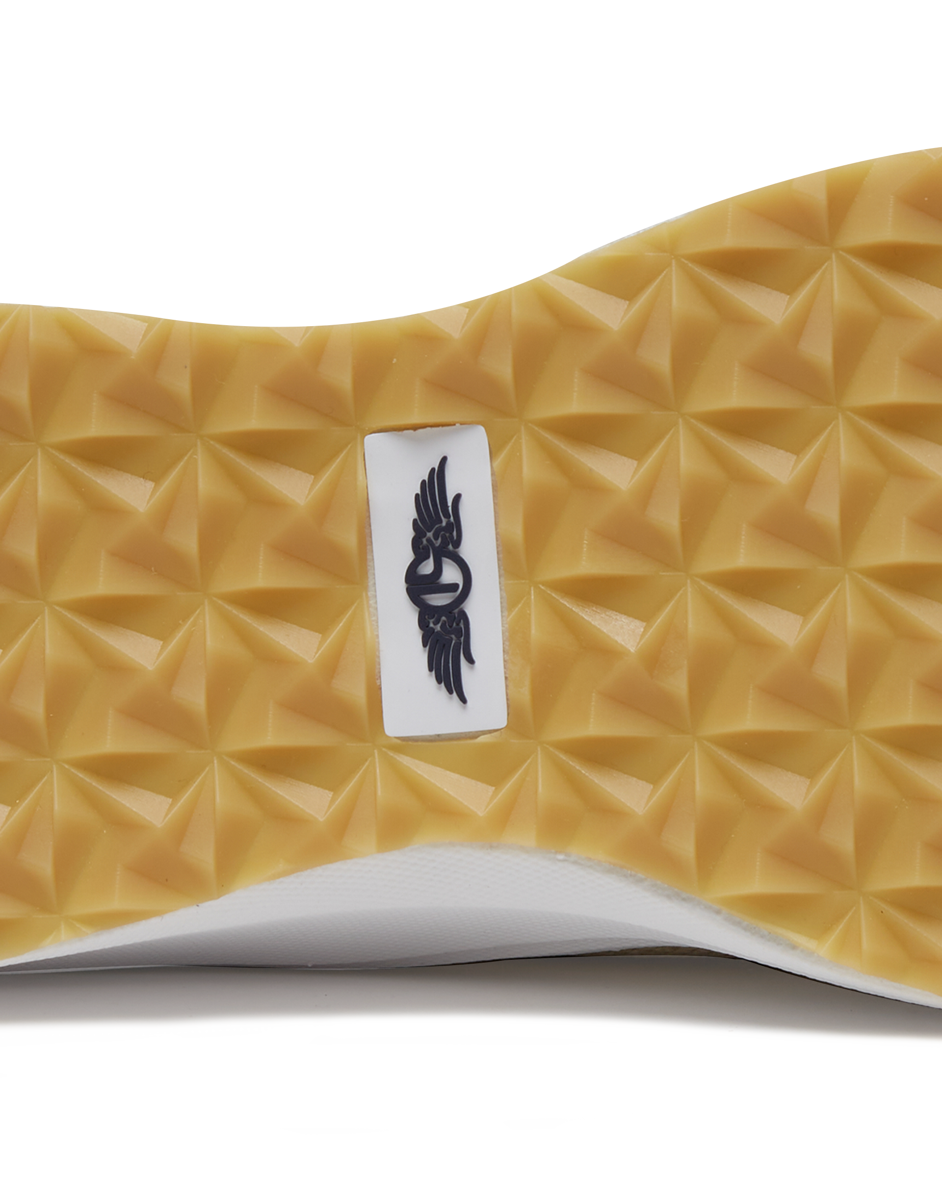 Straight Down Weekender Golf Shoe in Cashew, close-up outsole detail view featuring gum geometric pyramid traction outsole with Straight Down wing logo badge at arch
