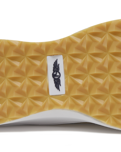Straight Down Weekender Golf Shoe in Cashew, close-up outsole detail view featuring gum geometric pyramid traction outsole with Straight Down wing logo badge at arch