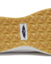 Straight Down Weekender Golf Shoe in Cashew, close-up outsole detail view featuring gum geometric pyramid traction outsole with Straight Down wing logo badge at arch