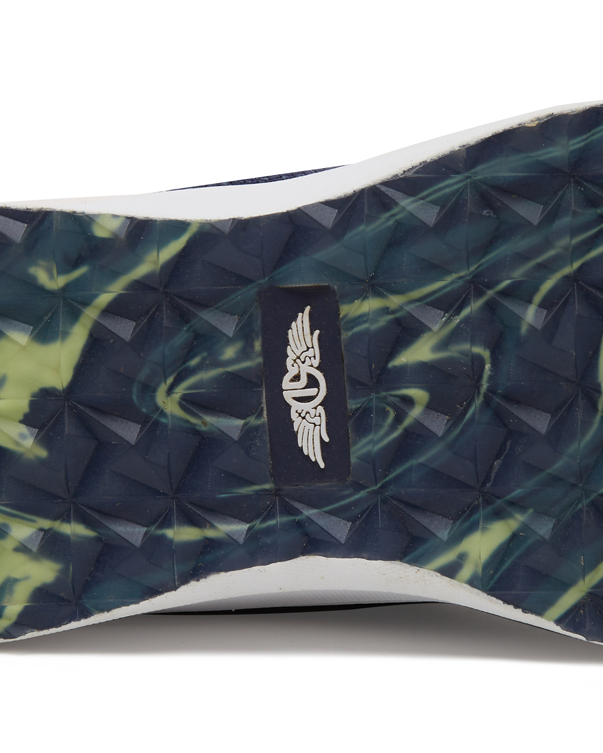 Straight Down Weekender Golf Shoe in New Indigo, close-up outsole detail view featuring navy and yellow marbled geometric pyramid traction outsole with Straight Down wing logo badge at arch