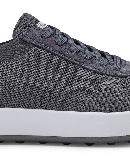 Men's Rally Shoe in Granite, detail close-up view featuring the dark gray knit upper texture, suede overlay at the toe box, lace-up closure, and white midsole with Straight Down logo at tongue