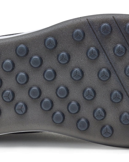 Men's Rally Shoe in Granite, detail close-up view of the outsole featuring dark gray multi-directional traction rubber studs and flex grooves for grip