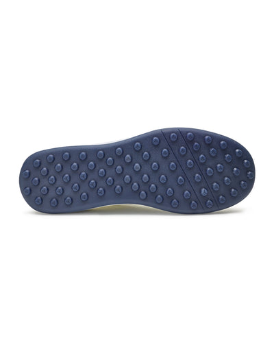 Men's Rally Shoe in White, bottom view featuring a navy rubber outsole with multi-directional traction rubber studs and flex grooves