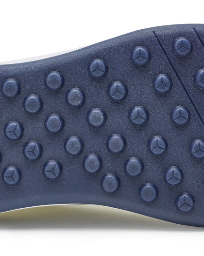 Men's Rally Shoe in White, detail close-up view of the outsole featuring navy rubber studs and flex grooves for traction and grip