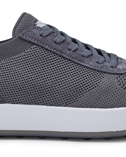 Men's Rally Shoe in Granite, detail close-up view featuring the dark gray knit upper texture, suede overlay at the toe box, lace-up closure, and white midsole with Straight Down logo at tongue
