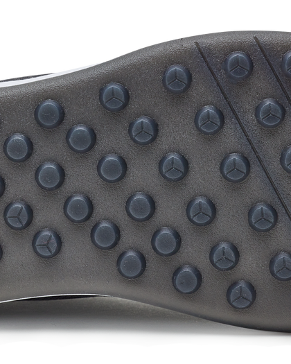 Men's Rally Shoe in Granite, detail close-up view of the outsole featuring dark gray multi-directional traction rubber studs and flex grooves for grip