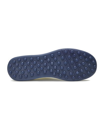 Men's Rally Shoe in White, bottom view featuring a navy rubber outsole with multi-directional traction rubber studs and flex grooves
