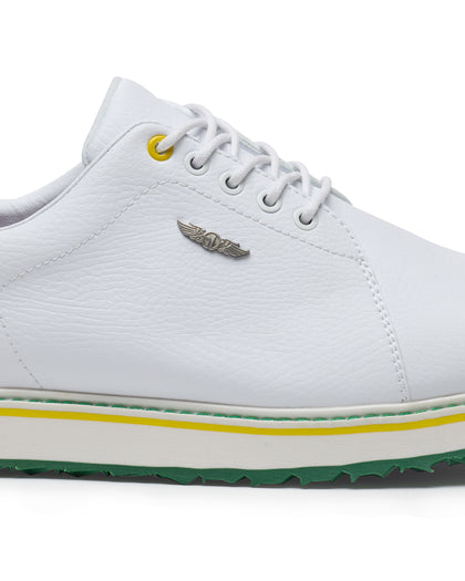 Straight Down Bourbon Hybrid Golf Shoe in White Verde, close-up lateral side detail view featuring white pebbled leather upper, silver Straight Down wing logo badge, yellow lace eyelet accent, white laces, white midsole with yellow and green stripe accents, and green traction outsole