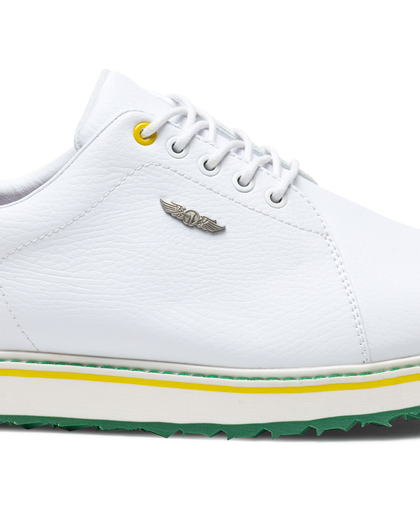 Straight Down Bourbon Hybrid Golf Shoe in White Verde, close-up lateral side detail view featuring white pebbled leather upper, silver Straight Down wing logo badge, yellow lace eyelet accent, white laces, white midsole with yellow and green stripe accents, and green traction outsole