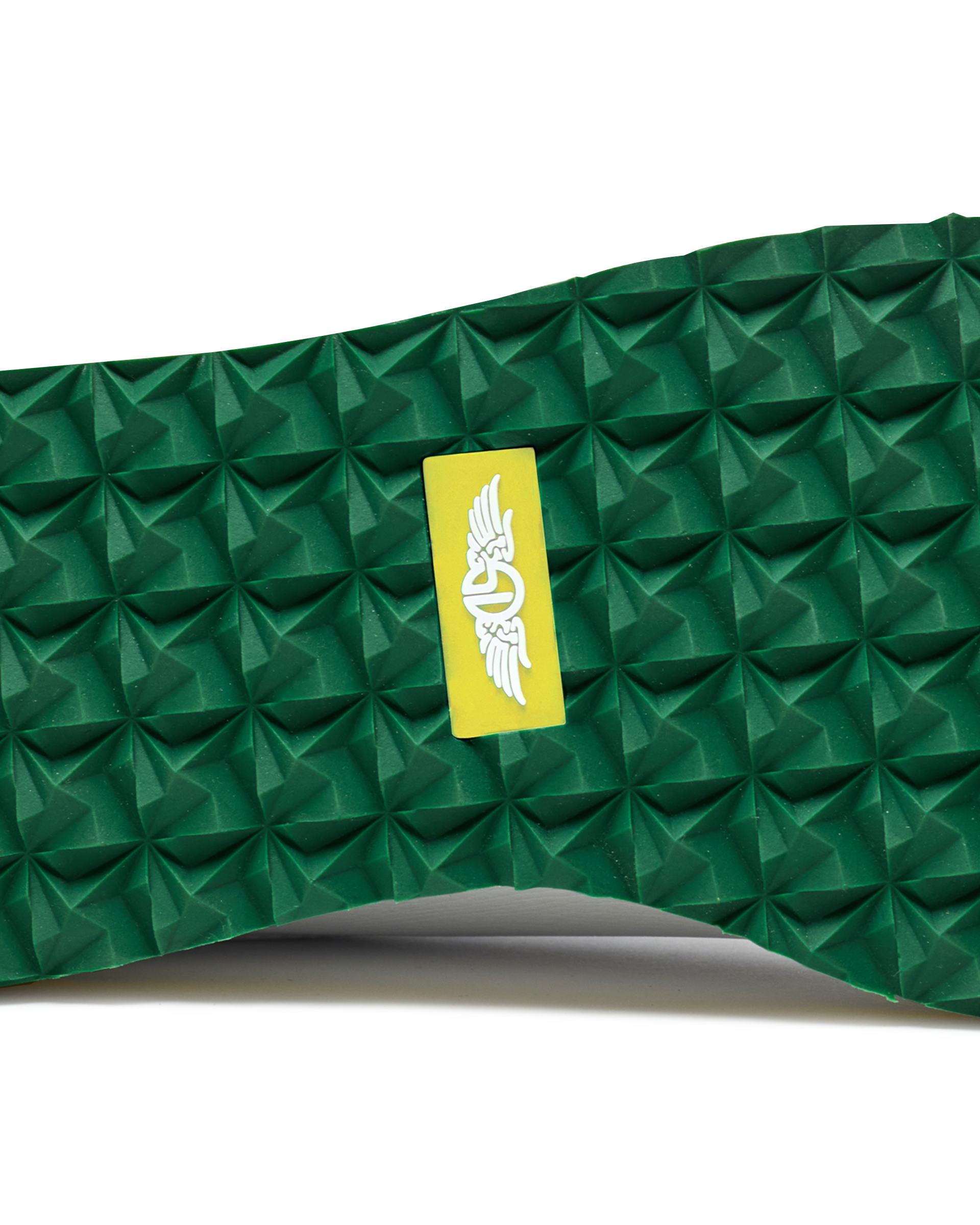 Straight Down Bourbon Hybrid Golf Shoe in White Verde, close-up outsole detail view featuring green geometric pyramid traction outsole with yellow Straight Down wing logo badge at arch