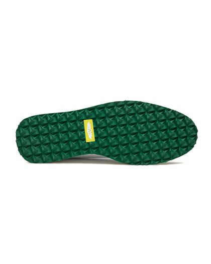 Straight Down Bourbon Hybrid Golf Shoe in White Verde, bottom sole view featuring green geometric pyramid traction outsole with yellow Straight Down wing logo badge at arch