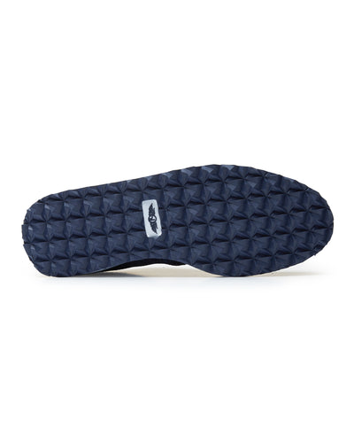 Straight Down Harbour Knit Hybrid Golf Shoe in New Indigo, bottom sole view featuring navy geometric pyramid traction outsole with Straight Down wing logo badge at arch