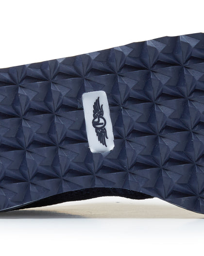 Straight Down Harbour Knit Hybrid Golf Shoe in New Indigo, close-up outsole detail view featuring navy geometric pyramid traction outsole with Straight Down wing logo badge at arch