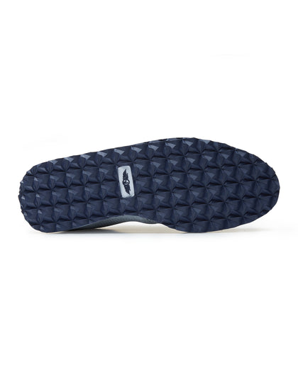 Straight Down Harbour Knit Hybrid Golf Shoe in Silver, bottom sole view featuring navy geometric pyramid traction outsole with light gray Straight Down wing logo badge at arch