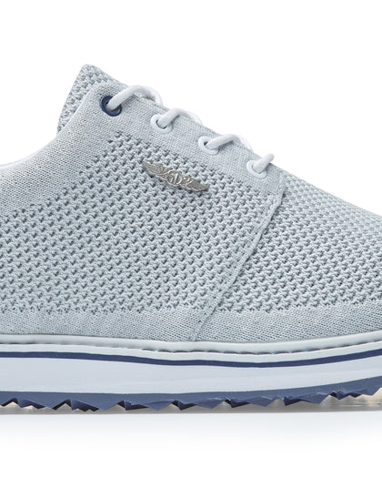 Straight Down Harbour Knit Hybrid Golf Shoe in Silver, close-up lateral side detail view featuring light gray knit upper, silver Straight Down wing logo badge, white laces, and navy stripe midsole accent
