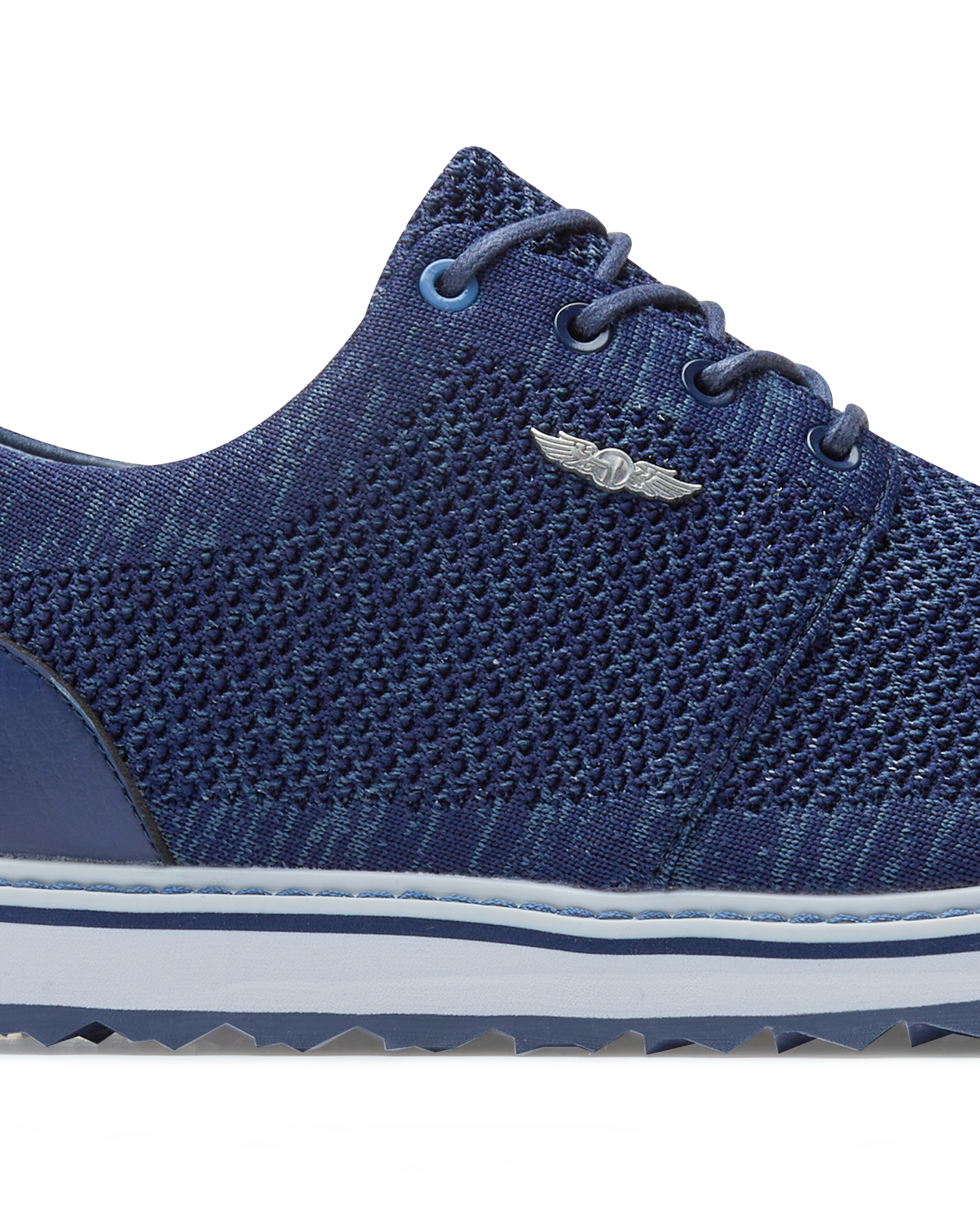 Straight Down Harbour Knit Hybrid Golf Shoe in New Indigo, close-up lateral side detail view featuring navy knit upper, silver Straight Down wing logo badge, navy laces, and white midsole with navy stripe accent