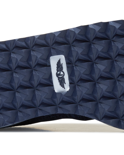 Straight Down Harbour Knit Hybrid Golf Shoe in New Indigo, close-up outsole detail view featuring navy geometric pyramid traction outsole with Straight Down wing logo badge at arch