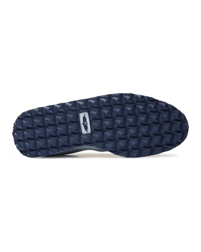 Straight Down Harbour Knit Hybrid Golf Shoe in Silver, bottom sole view featuring navy geometric pyramid traction outsole with light gray Straight Down wing logo badge at arch