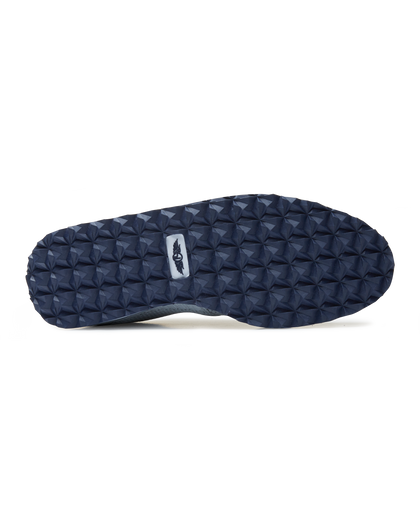 Straight Down Harbour Knit Hybrid Golf Shoe in Silver, bottom sole view featuring navy geometric pyramid traction outsole with light gray Straight Down wing logo badge at arch