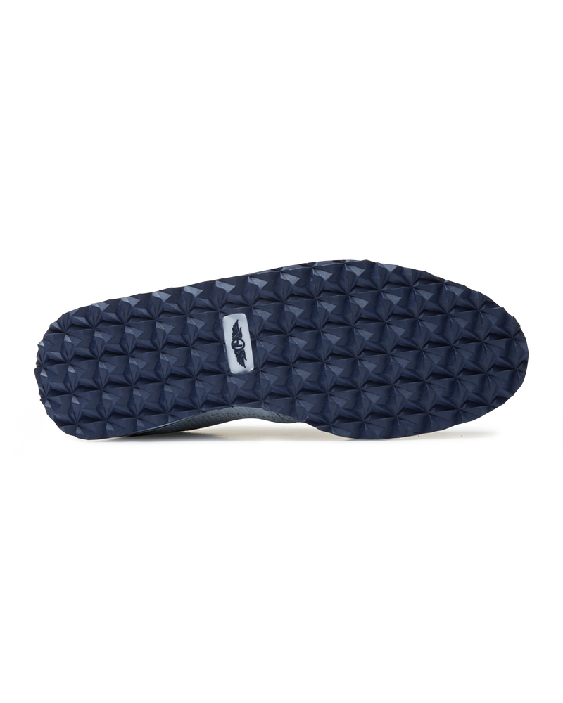 Straight Down Harbour Knit Hybrid Golf Shoe in Silver, bottom sole view featuring navy geometric pyramid traction outsole with light gray Straight Down wing logo badge at arch