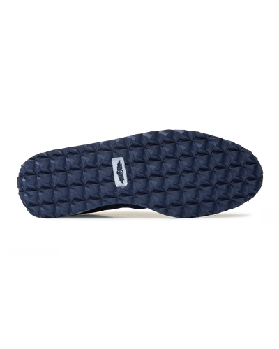 Straight Down Harbour Knit Hybrid Golf Shoe in New Indigo, bottom sole view featuring navy geometric pyramid traction outsole with Straight Down wing logo badge at arch