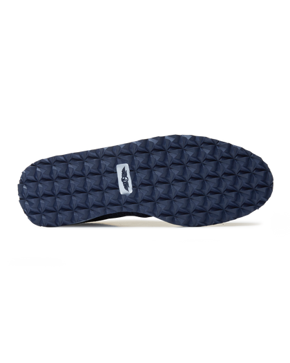 Straight Down Harbour Knit Hybrid Golf Shoe in New Indigo, bottom sole view featuring navy geometric pyramid traction outsole with Straight Down wing logo badge at arch