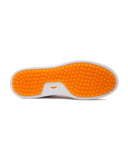 Straight Down Boardwalk Golf Shoe in Stone, bottom sole view featuring solid orange circular traction nub outsole with white arch bridge and orange Straight Down wing logo badge at center