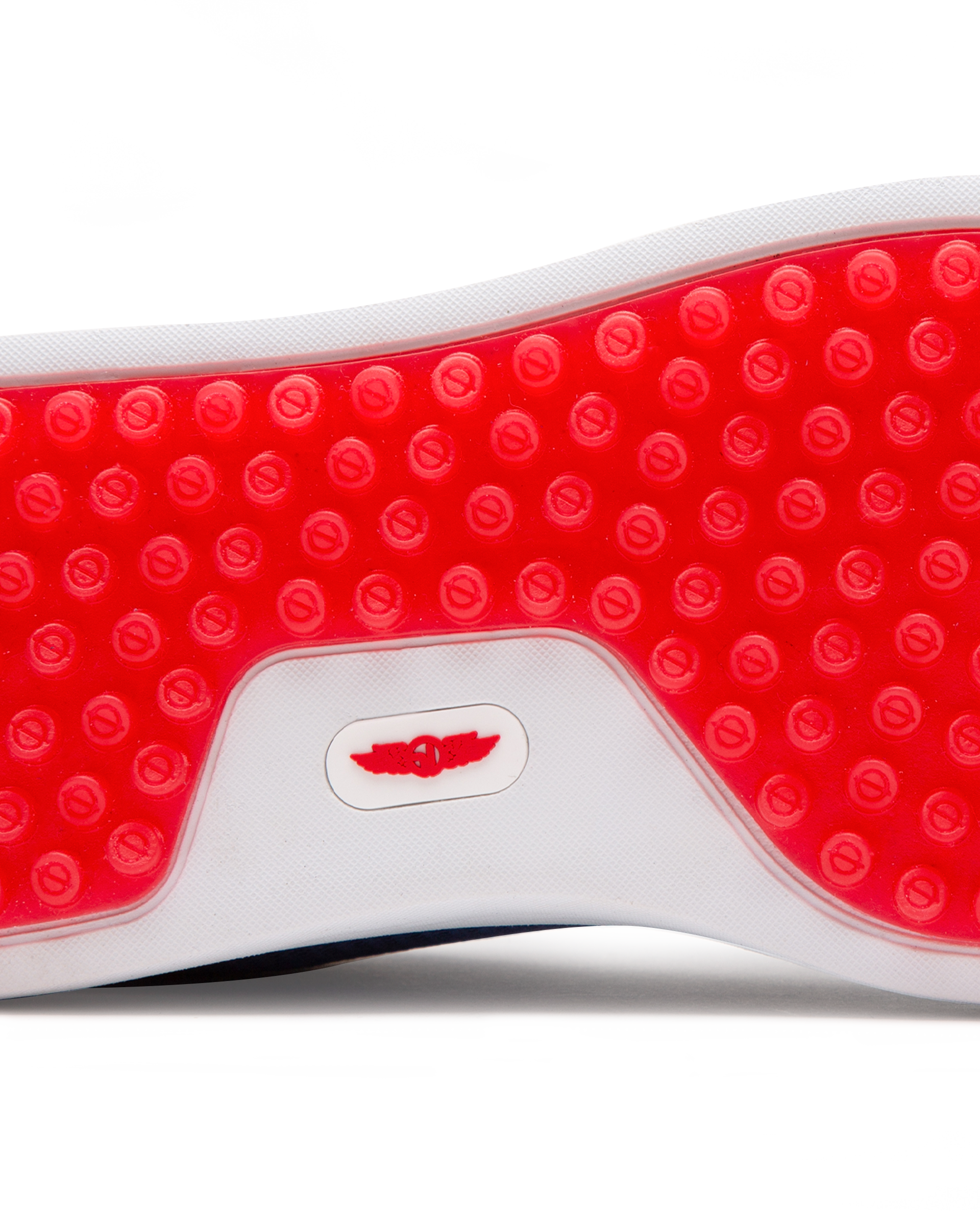 Straight Down Boardwalk Golf Shoe in Federal, close-up outsole detail view featuring solid red circular traction nub outsole with white arch bridge and red Straight Down wing logo badge at center