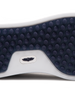 Straight Down Boardwalk Golf Shoe in Petrol, close-up outsole detail view featuring solid navy circular traction nub outsole with white arch bridge and navy Straight Down wing logo badge at center