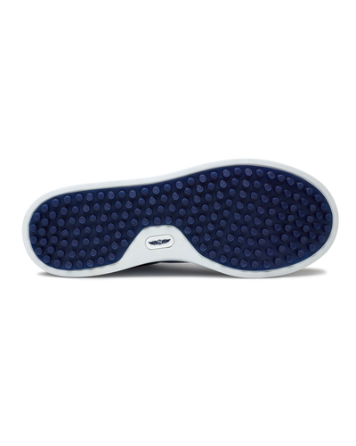 Straight Down Boardwalk Golf Shoe in Petrol, bottom sole view featuring solid navy circular traction nub outsole with white arch bridge and navy Straight Down wing logo badge at center