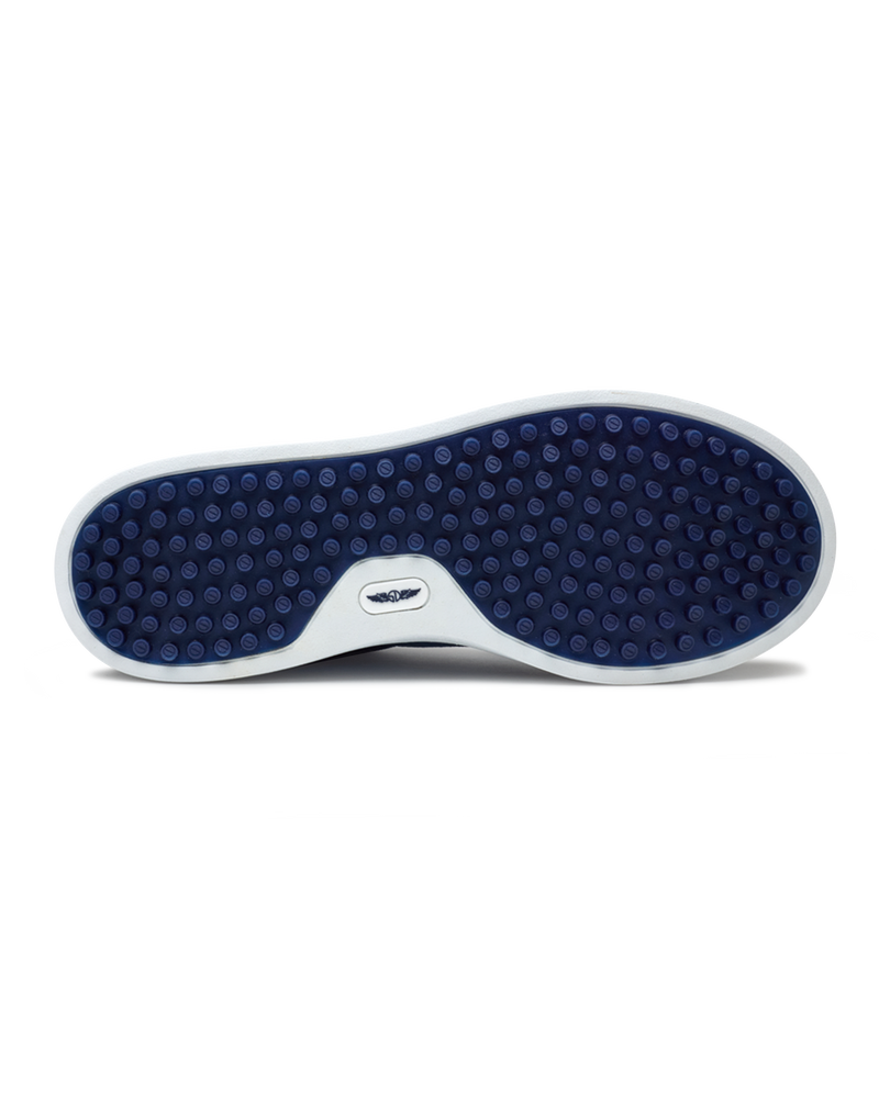 Straight Down Boardwalk Golf Shoe in Petrol, bottom sole view featuring solid navy circular traction nub outsole with white arch bridge and navy Straight Down wing logo badge at center