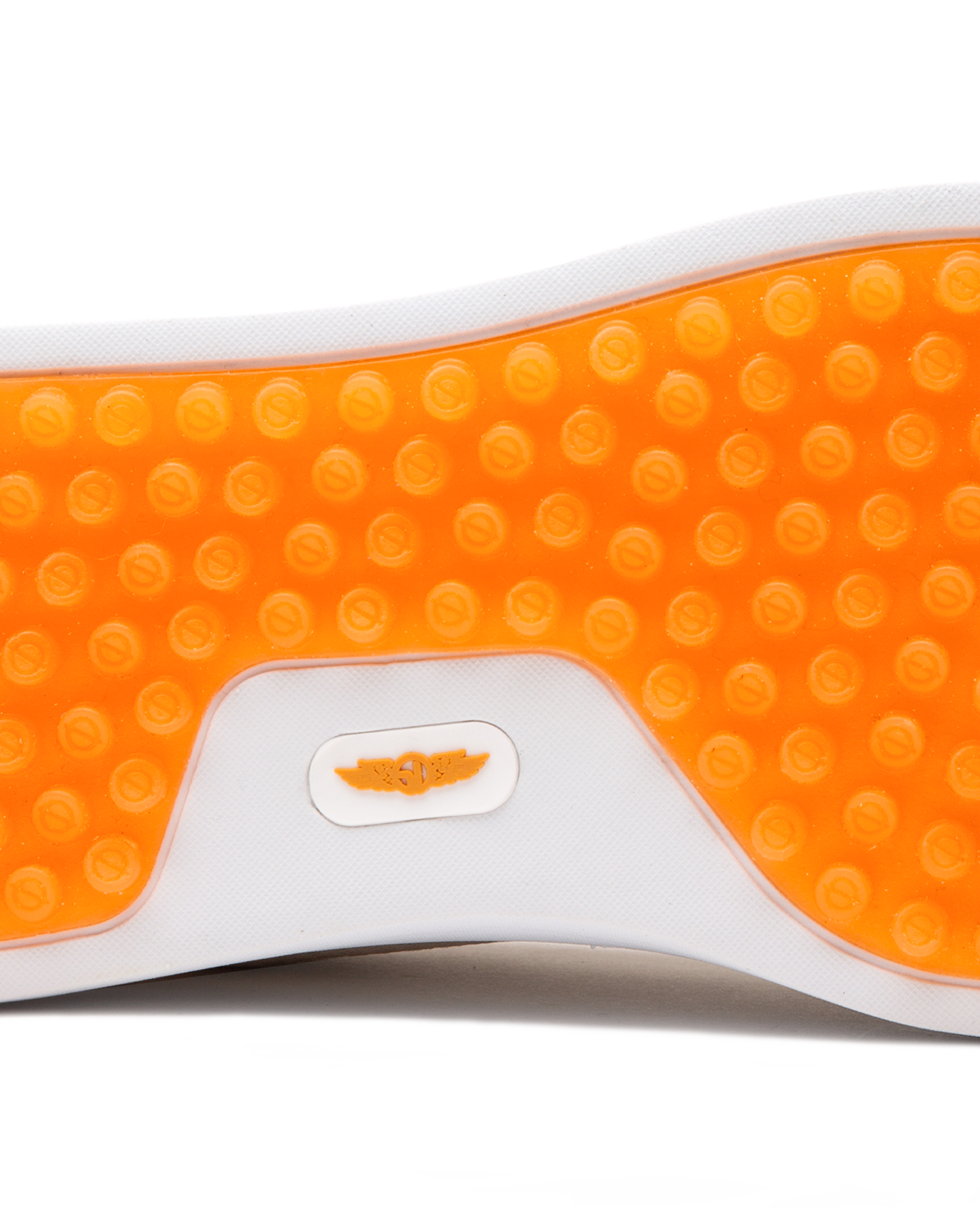 Straight Down Boardwalk Golf Shoe in Stone, close-up outsole detail view featuring solid orange circular traction nub outsole with white arch bridge and orange Straight Down wing logo badge at center