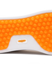 Straight Down Boardwalk Golf Shoe in Stone, close-up outsole detail view featuring solid orange circular traction nub outsole with white arch bridge and orange Straight Down wing logo badge at center