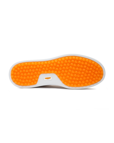 Straight Down Boardwalk Golf Shoe in Stone, bottom sole view featuring solid orange circular traction nub outsole with white arch bridge and orange Straight Down wing logo badge at center