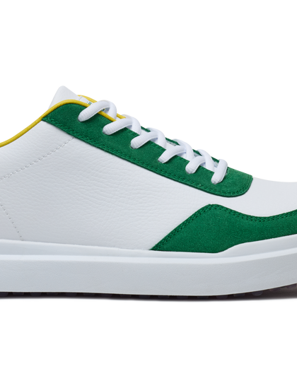 Straight Down Boardwalk Golf Shoe in Verde, close-up lateral side detail view featuring white pebbled leather upper, green suede toe box and heel overlay, yellow collar trim, and white laces