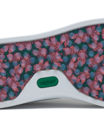 Straight Down Boardwalk Golf Shoe in Verde, close-up outsole detail view featuring floral hibiscus print with circular traction nubs in pink and blue tones and green Straight Down wing logo badge at arch