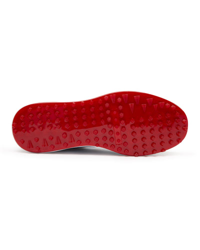 Straight Down Defender Golf Shoe in Camo Ocean, bottom sole view featuring solid red mixed traction outsole with hexagonal and triangular lugs, white midsole edge, and white arch bridge