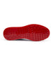 Straight Down Defender Golf Shoe in Camo Ocean, bottom sole view featuring solid red mixed traction outsole with hexagonal and triangular lugs, white midsole edge, and white arch bridge