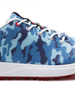 Straight Down Defender Golf Shoe in Camo Ocean, close-up lateral side detail view featuring blue tonal camouflage print upper, red lace eyelet accents, white laces, white midsole, and red traction outsole